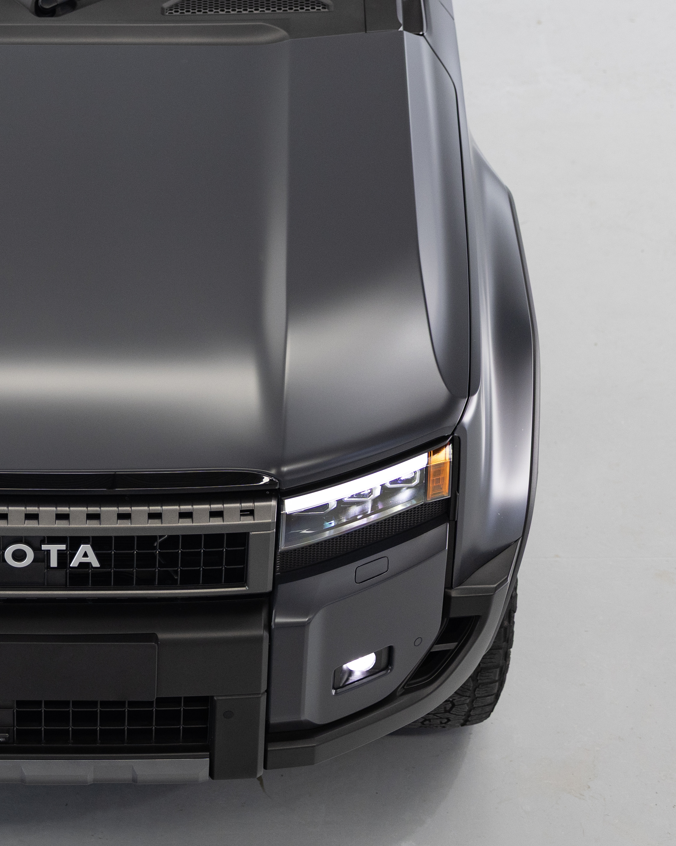 Close-up of bonnet and guard on Prado 250 showing uniform satin Stealth PPF finish